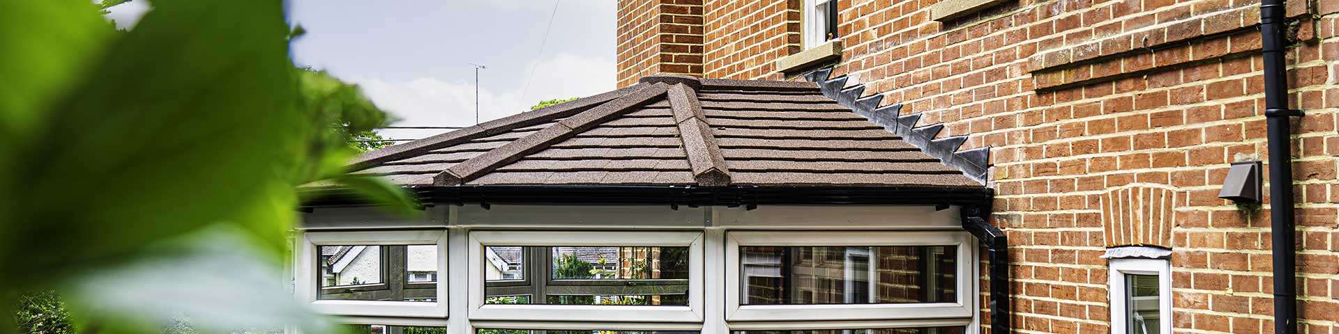 diy-victorian-conservatory-bay Exterior view of a traditional multi-faceted Victorian conservatory kit showcasing its distinct period design